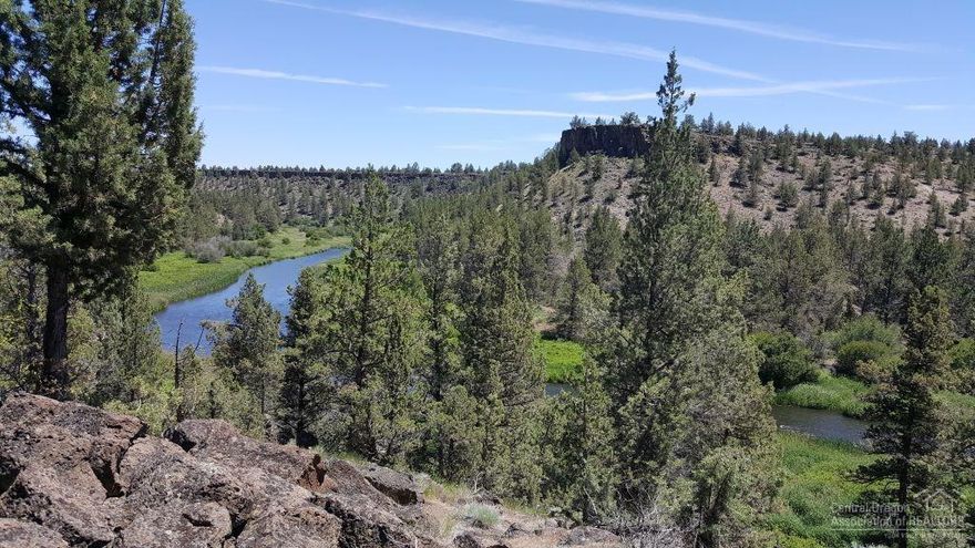 Unique and private one-level home on 22 acres with 400 ft of Deschutes River frontage in the heart of Central Oregon offering many options for today's lifestyle. Enjoy sunrises over the river from the great room picture windows, master bedroom, den or partially covered deck all set up for your new hot tub! A perfect perch to watch the waterfowl, deer and other wildlife or simply watch the river sparkle in the sun without another home in sight. The 3 bedroom home with 1,840 sq. ft. was recently updated with new flooring, alder cabinets, countertops, stainless appliances, lighting, tiled showers, paint and so much more!. The property is bordered by thousands of acres of public lands for trail rides and recreating. Just 14 minutes to the airport, and 5 miles to Smith Rock, shopping and restaurants. Float, fish, paddle, hike, bike, work and relax!