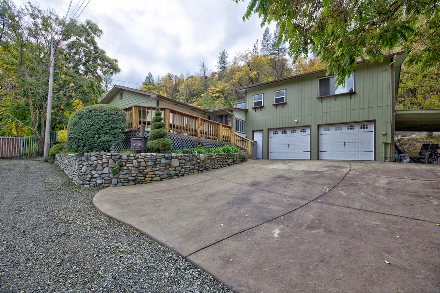 BOM due to no fault of property. Comfortable and elegant living in this lovely neighborhood home. Updated living spaces, boasting tile floors, beautiful kitchen cabinets and newer exterior paint. Large walk-in closet and tile shower attached to the roomy primary bedroom. Beautiful views and fully fenced private backyard, with front wrap around deck. Lots of area for gardening with 0.35 of an acre. Large attached garage for your vehicles/toys, with extra storage area/carport. Cozy fireplace within the open floorplan styled living room/dining room. Storage shed in the backyard.