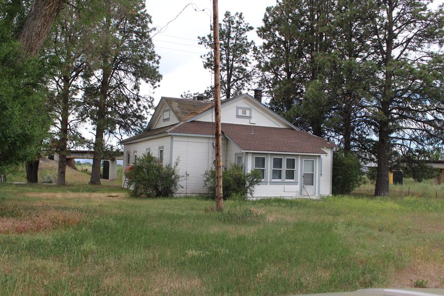 HISTORIC POPE RANCH offering 499.66 acres with 392.11 irrigated with District and well water--10 wheel lines, 1 pivot, gated pipe & solid set.  Quality soils for alfalfa, garlic and potatoes with some pasture. Beautiful 4 BR, 2.5 B, daylight basement with gorgeous views from both level of the house.    Covered  patio, deck, open beams in the house along with laminate, tile, carpet, kitchen island, central vacuum & pantry are just some of the many amenities.   There is a ranch hand older 3 bedroom, 1 bath home also.  Out buildings include a red barn, older cold storage, 2 older potato cellars, 4 hay sheds and 5 grain bins. Solar panel   on tne well and also on the main home for monthly benefits.  $2,300,000.
