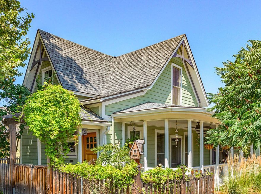 A Victorian gem in Ashland's charming Railroad District! The grand, high ceilings enhance the sense of space as you enter. Perfectly blending historic charm with modern luxury, this home boasts a spacious, updated kitchen with elegant marble countertops, high-end appliances including a Wolf range and double oven with microwave, ideal for culinary enthusiasts. The living room features a new gas fireplace with antique detailing. There is a generously sized dining room off the kitchen with a wood burning fireplace. Beautifully landscaped backyard offers a serene retreat for outdoor gatherings or quiet relaxation in multiple spaces. Upstairs, you'll find all three bedrooms, a remodeled bathroom and a deck that includes views of the mountains. Located in the heart of Ashland, you'll enjoy the convenience of vibrant small city life alongside the tranquility of a beautifully restored classic. Discover the perfect fusion of past and present in this exquisite residence on an R-2 lot!