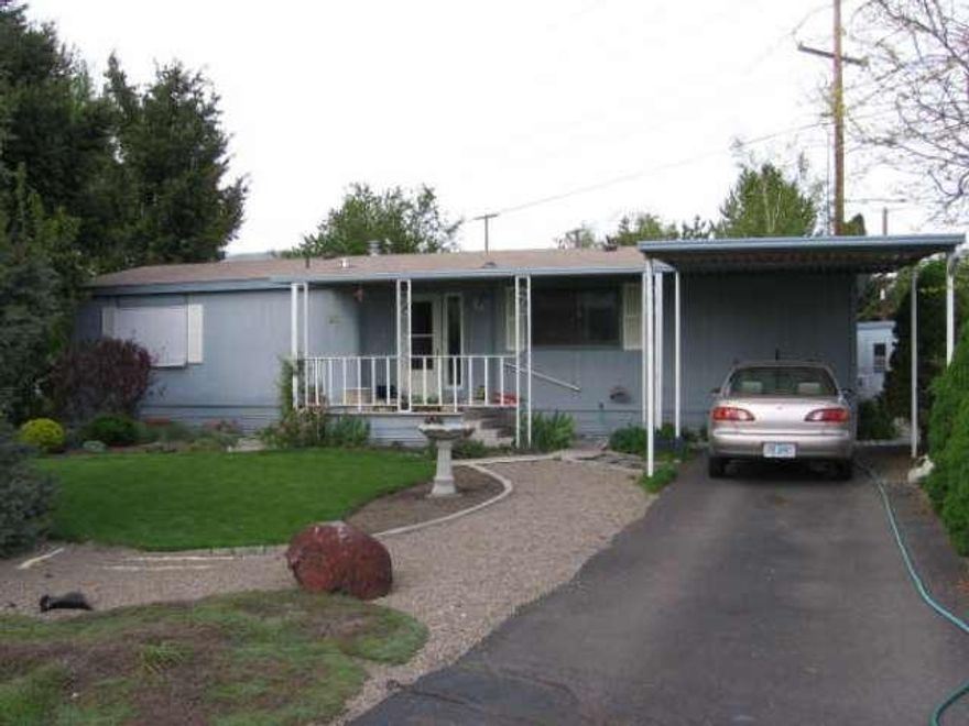 This Home Should Be In better Homes And Gardens! Don't Let The Age Fool You! Beautiful Berber Carpet, Custom Drapes In Livingroom, Upgraded Gas Furnace And A/C. Large Covered 10 X 46 Deck In Back, And Covered Front Deck Too! Largest Yard In Park Beautifully Landscaped. 2 Sheds And Full Fenced. Tastefully Decorated, Lots Of Storage, Garden Tub In Master Bath And More! Owner's Son Is House-sitting. Call Ken Wilson To Show At (541) 621-2577.