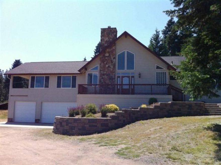 Stellar home with outstanding views. This home is very inviting, open plan with rocked wood fireplace and Brazilian wood floors & large kitchen with double ovens, built-in microwave. All are stainless steel, and granite counters. Great home for entertaining and entertainment is all round with Mt. Ashland Ski Resort minutes away.