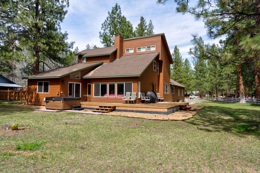 LOCATION! This Tollgate home sits on a premier .56 acre lot that borders acres of Forest and Public School land. A wonderfully flexible floor plan with two bedrooms and two full bathrooms downstairs. Two bedrooms, full bathroom and several fun loft areas accessible by built-in ladders (private fort spaces?). Wood beams and warm paneling accent the vaulted living room that includes a wall of windows to let in our Central Oregon sunshine. A dining room with a bank of cabinets, and the eat-in kitchen is loaded with storage! Oversized double garage, fenced dog area and huge back deck. The home, not including the lofts, is 2,349 square feet located in a quiet cul-de-sac. Pool, tennis, pickleball, basketball, clubhouse and park are all part of your homeowner's enjoyment. Vacation rentals allowed. Horses allowed in the Tollgate community. Two miles to the town of Sisters.