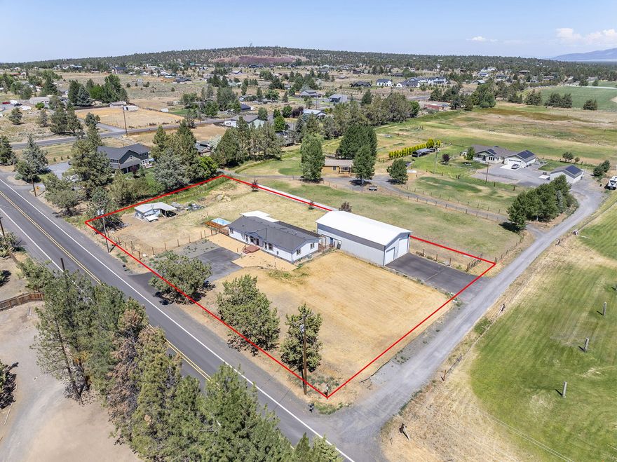 Enjoy the best of Central Oregon living on this 1.19 acre property in sought after Tumalo. Well kept manufactured home features a spacious great room floor plan and updated kitchen. The primary suite offers a generous bathroom with a soaking tub and large closet. Two additional bedrooms, laundry/mudroom, and side and rear decks complete the living space. Impressive 1,800 sqft shop is equipped with RV and standard doors, a loft area, and two lock off rooms - ideal for projects, storage, or a home based business. Zoned MUA10 with 1ac COID irrigation. Located just minutes from Costco and Bend amenities, downtown Tumalo, or Redmond and the airport, this property offers a unique opportunity to enjoy rural charm without sacrificing convenience.
