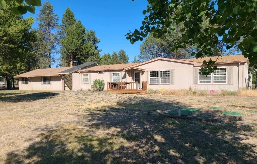 Beautiful views of Paulina Peak from this fully fenced 1.54 acre property just moments away from Quail Run Golf Course in the lovely neighborhood of Lazy River South on the North side of La Pine. This single level, 1782 SF home has 3 bedrooms, 2 bathrooms and sits on a level lot on a quiet and private cul-de-sac. Spacious primary suite with nice separation from other two bedrooms. Large open living area with dining room and breakfast bar in a light and bright kitchen with all appliances included! Side entrance and second living area opening to a peaceful deck perfect for enjoying the view of Paulina Peak. Detached 925 SF garage/shop offers plenty of space for storage. Small greenhouse and plenty of room for all your animals as well. So many opportunities with the Deschutes River just moments away; easy access to Sunriver, Mt. Bachelor, Bend and all of Central Oregon!