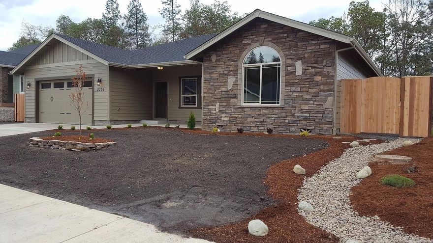 This new 1952 square foot home has just been completed in Phase 7 of Meadow Wood Subdivision. It has a great room floor plan,so the chef can be part of the activity yet has the island as a buffer from the rest of the room. The kitchen appliances are Amana. Granite counter tops are throughout the house. The ceilings are either vaulted or are 9 foot high. There's tile flooring in the laundry room plus a sink and counter. Tile flooring is in both bathrooms and they have double sinks. The master bath has a large step-in shower. All 3 bedrooms have walk-in closets. The furnace is gas along with the hot water. The 624 square foot double car garage has plenty of room to putter. The front and back porches are under roof cover. The back and side yards are completely fenced in. Landscaping is in and everything is ready for you to move in! Comes with a 10 year home owners warranty.