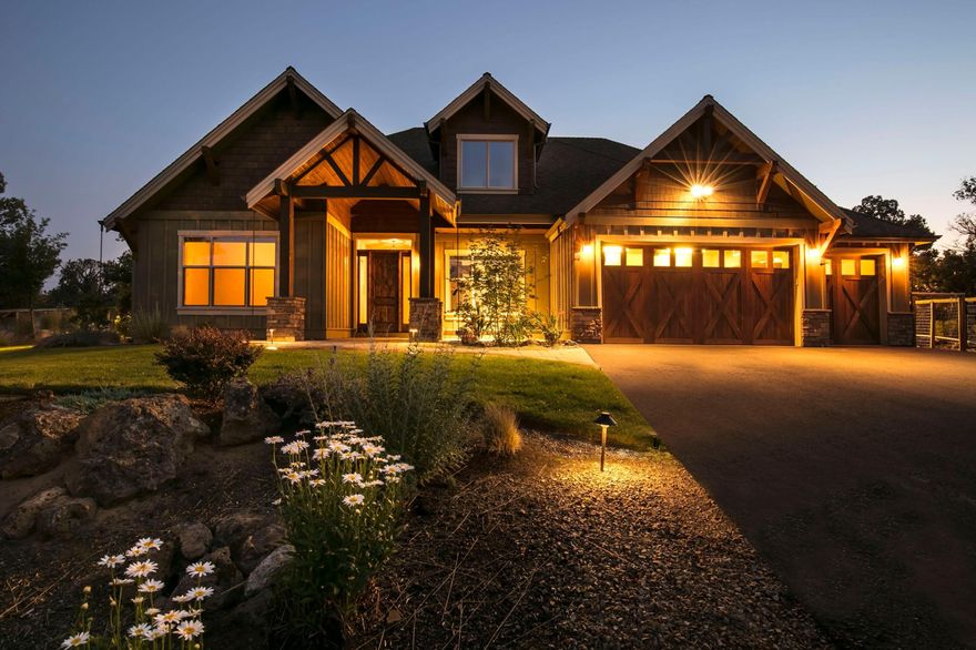 NEW PRICE!!   Beautiful 4 Bedroom + Office home on private acreage backing BLM 10 minutes from from town!   Paved driveway leads you to this Absolutely stunning home on 11.8 acres. 
Walk into the vaulted great room with fireplace.  Stunning Knotty Alder Cabinetry, Solid Core Doors, and Built-ins.  Most of the living space is on the main level.  The second level includes a large bonus room with built ins and separate extra bonus space.   The main level primary suite includes built ins,  private bathroom with soaking tub, separate steam shower, Large walk in closet.    Beautiful glass doors from the primary bedroom to the Incredible back yard oasis.  Completely fenced and includes swimming pond with slide, sand beaches, water fall feature, and outstanding landscaping.  There is also a Large covered patio and padded play area.   The list of amenities continues with another fenced area for animals and shed with power.   Lots of potential to develop remaining acreage for animals