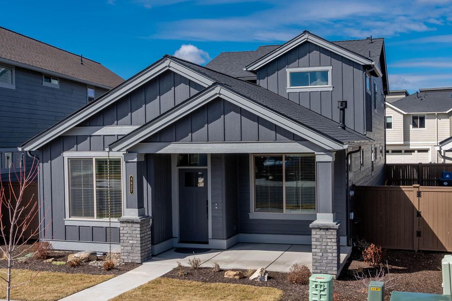 Better than new! This 5 month old beautiful Triple Ridge home has it all!  Never occupied, it comes with all SS Whirlpool appliances including  4 door SS Whirlpool refrigerator, smart locks, smart thermostat, blinds throughout, Ring doorbell, glass shower doors & A/C. The downstairs features an open GR w' cozy gas FP, ½ bath, dining area, large kitchen w' island eating bar, & primary suite w' walk-in closet. Upstairs is a loft area plus a spacious bonus room along w' 2 additional bedrooms both w' small walk-in closets plus a full bath. Quality finishes include quartz countertops in kitchen & baths, undermount sinks, engineered wood plank flooring in main downstairs living area, baths & the utility room, solid Alder cabinets, & natural gas appliances. HOA inc front yard lawn maintenance.  Amenities include a seasonal pool, picnic pavilion w/BBQ, eating area, parks, & walking paths.  Great location offering easy access to  RDM airport, Bend & other popular Central Oregon destinations.