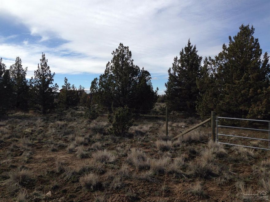 A very nice 1.87 acres with peekaboo looks at the Cascades! Only about 10 miles from Prineville. All paved to the property except about 100 yards! An area of nice homes, with power at the lot. Would make a wonderful full time or vacation home.