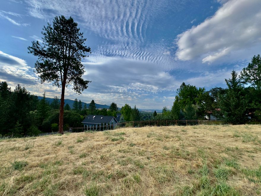 Here's your chance to build the home of your dreams in one of Jacksonville's most desirable neighborhoods. This exceptional .61-acre lot sits on a quiet private lane in the prestigious Westview Heights community, surrounded by luxury homes and offering sweeping views of the Table Rocks, Rogue Valley, and city lights.

Enjoy both privacy and convenience—just minutes from historic downtown Jacksonville's charming restaurants, boutique shops, wine tasting rooms, hiking trails, and the beloved Britt Music Festival.

City services including water, sewer, natural gas, and cable are available & this lot is also a short drive to top medical centers & the airport.

Picture sipping wine on your future porch as the sun dips behind the mountains, or entertaining with the valley twinkling below. Whether you're ready to build or planning ahead, this breathtaking property offers the perfect blend of beauty, location, and lifestyle. Bring your visions and your dreams for a peaceful lifestyle.