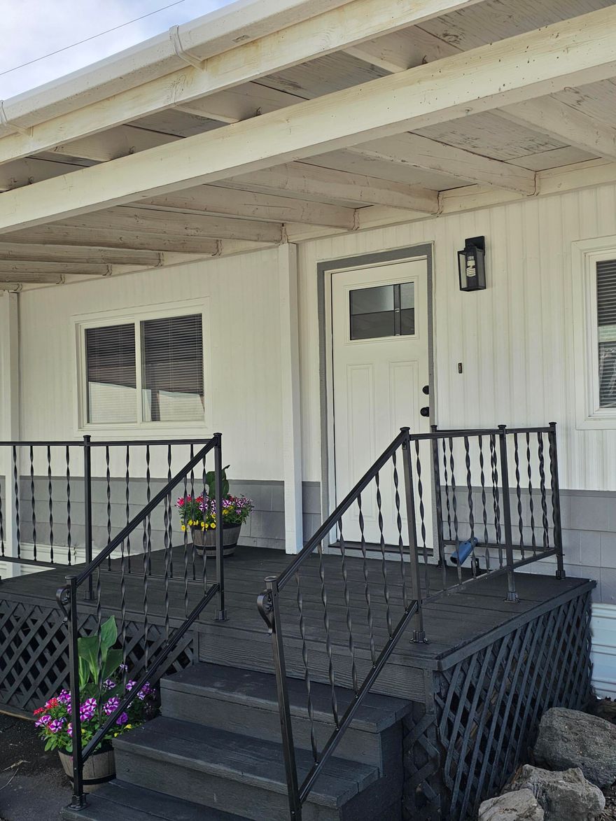 ALMOST ALL BRAND NEW!! CUTE 2 bedroom 1 bath manufactured home that has been all redone. All new flooring, fresh paint inside and out, new sink, faucets, countertops, fixtures, new interior and exterior doors. It's so fresh and clean and bright!! The hard part is done! Just sit back on the perfect little deck and enjoy. Great open floor plan, on a corner lot. Tons of storage, especially for the size. New buyer must get park approval. Monthly space rent is $235