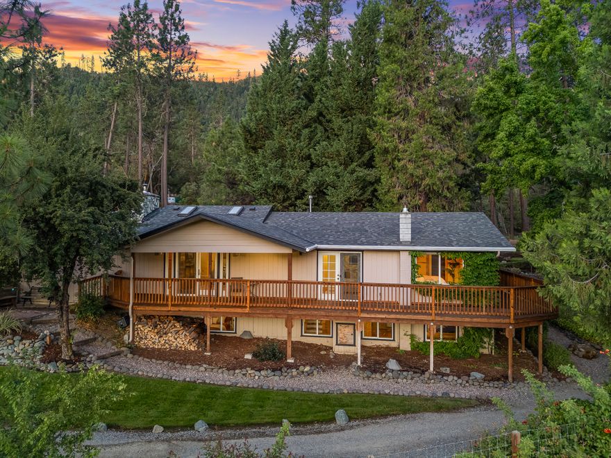 Sprawling 176-acre ranch less than two miles from Applegate boasts serenity and convenience. This 3 bed, 2 bath ranch home overlooks a versatile farm set up for multiple land uses, commercial agriculture and ranching with epic water rights! Made up of 3 tax lots—162.76 acres zoned WR with a large trail network connecting to thousands of acres of BLM land, perfect for hunting, motocross, horseback riding and more. The 12.96-acre EFU-zoned lot includes a 2,800 sq ft 2-story barndominium with stables below and a 1,400 sq ft finished office and storage space above, complete with kitchenette and permitted bath. Property includes 2 barns, 2 ponds, paddocks, orchard, commercial greenhouses, guest cabin, and more!