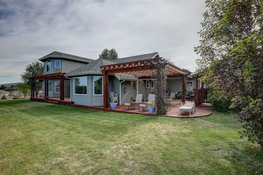 Stunning Tumalo Home on 20 Lush Acres!  Beautiful 2 story, updated home with gourmet kitchen, family room with fireplace, formal living room & master suite with a tiled bathroom.  Spacious bonus room or office over the triple car garage plus main level living with 2 bedrooms & bath upstairs.  Extensive cedar decks with spectacular views, 3 pergolas, water feature & well house that doubles as a service bar.  Lush irrigated pastures with 3 ponds for animals, various crops or just privacy.  Masonry privacy wall with entry gate with ample RV parking.  Incredible opportunity to purchase this stunning ranch that has all the County approvals for three major equestrian shows per year with RV hook-ups...call for more details.  Did we mention the panoramic mountain view!