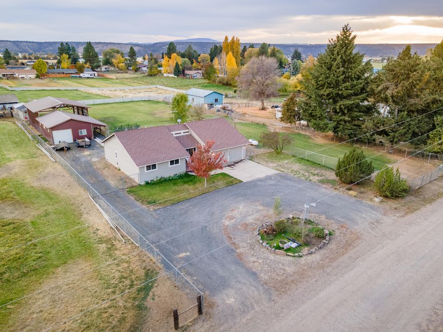 Looking for a move-in ready home on acreage? Well look no further... you've found your new home! This must see 3 bedroom, 2.5 bath home has undergone many updates, including new Dabella windows, granite counters, vinyl flooring, carpet & much more. Enjoy peaceful summer mornings sitting on the front deck, watching the hummingbirds on this pristine 1 acre irrigated property minutes from town. This bright home has abundant natural light & a comfortable family space w/ formal living room & a family room adjacent to the spacious kitchen. The backyard is fenced and cross fenced w/ plenty of room for livestock. No need to build a shop... there is plenty of space in the 20x20 insulated  & sheeted shop for all of your projects, in addition to the 30x30 covered pole barn. Another bonus to this property is the ability to watch the annual fireworks display right from your back patio. Don't miss out on this beautifully updated home. See the document listing updates that have been completed.