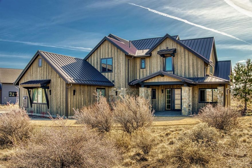 Stunning southern views across the well established neighborhood in Tetherow and Tartan Druim. Situated .64 of an acre, this custom Northwest contemporary 4,348 sf home features the master bedroom, office with a closet, kitchen/dining, half bath, large utility room w/sink & 3 car garage on the main level. Second master suite, 2 additional en-suites, bonus media room upstairs. Luxurious updates include; state of the art home audio system throughout, automatic blinds w/ remote access, custom cabinetry in all closets & pantry, double walled plumbing on 2nd floor for soundproofing, soundproofing insulation from media room to interior walls of the home, alarm system, central vacuum, metal roof, fire pit, extended second floor patio. Home to be sold mostly furnished! This is a must see property!