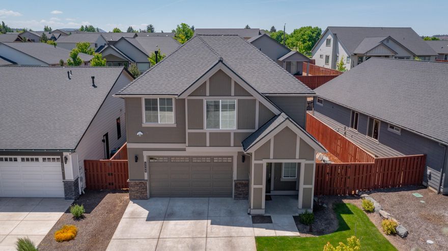 Welcome to this immaculate 4 bed, 2.5 bath home offering 2042 sq. ft. of stylish and functional living space in the desirable Ochoco Pointe subdivision. Built with quality and comfort in mind, this almost new home features an open concept layout, spacious living and dining areas, gas fireplace and a well-appointed kitchen with modern finishes, a pantry and ample storage. The primary suite offers a peaceful retreat with a generous walk in closet, ensuite bathroom w/ a tile shower and a double vanity. Three additional bedrooms and a full bath upstairs provide plenty of additional living space. Enjoy the convenience of an upstairs laundry room, A/C and 2 car garage. Head outside to your landscaped backyard and covered patio. Close to downtown, this community also offers access to shared amenities including a pool, sport court, park and walking paths. Move in ready and meticulously maintained-this home is a MUST SEE!!