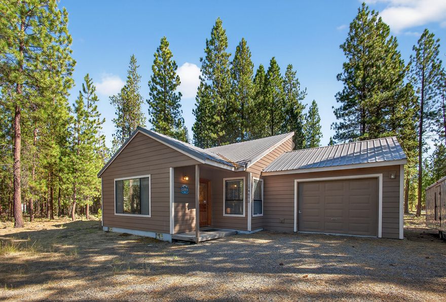 A Paradise for Outdoor Enthusiasts! Step outside your front door and hop on your snowmobile—this property offers direct access to endless BLM land for year-round adventure. Enjoy lakes, skiing, and hiking just minutes away.

Major Upgrade: A brand-new $27,000 ATT septic system was installed on August 18, 2025.

Cozy & Expandable: This charming cabin offers warmth and comfort, with vintage appeal and a wood stove that keeps winter chills at bay. There's plenty of space to expand—build a shop, add an extra room, or customize to your heart's content.

Room for All Your Toys: Situated on a corner lot with easy access , there's ample parking for large RVs, boats, and trailers.  (There is a circular driveway in front that connects also to another access point from the back side of the property.)

Fully Furnished Option: The seller would like an ''as is'' sale including furnishings, making this a truly move-in-ready opportunity.