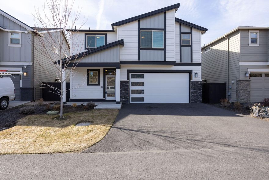 Four bedroom home in NE Bend! This contemporary Copeland plan from Pahlisch Homes features an open floor plan with 4 bedrooms, 2 bathrooms & laundry up, with an additional half bath down. Kitchen boasts a large island with breakfast counter, under cabinet lighting, full height backsplash, corner walk in pantry, and stainless appliances. Primary Suite has a spacious walk in closet, double sinks, tiled shower, water closet and separation from other bedrooms. Quartz tops and knotty alder cabinets throughout, large laundry with folding counter, painted wood blinds, and cozy gas fireplace in great room with stacked stone surround. Back yard offers a covered concrete patio, landscaped with sprinklers on timer. Lava Ridges community features a seasonal swimming pool for your enjoyment, and is situated just across the street from Pine Nursery park and sports complex, and close proximity to elementary and middle schools. Cute, clean, and ready for you to make this house your home!