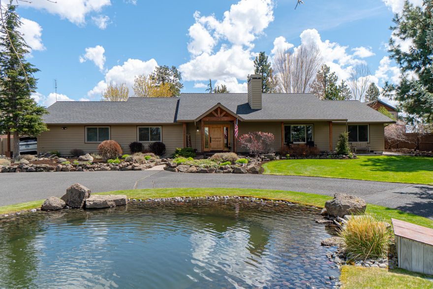 A very special property, single level on a 1.49a lot, .5 a irrigation rights with pond and water feature & mountain views located in town in an area of larger lots. You will love this immaculate property that has it all. Vaulted ceilings, open floor plan, wood trim, solid wood doors and with wood windows. Wood flooring recently refinished. Living, family room plus a large Office/school/hobby room with separate entrance and bath.  Large master with his and her walk in closets. 2 additional bedrooms have private bathrooms. Large laundry/mud room. Large kitchen & dining great for family and entertaining. Covered back paver patio with outdoor hot tub. Large dog kennel area off of shop. 36X36 shop/garage has 1-12' door & 2-8' doors. An additional well built metal structure next to the shop house a RV trailer and large truck. Back yard is fully fenced and cross fenced. Come and see this amazing property! https://youtu.be/fTU6h1KB6Ms