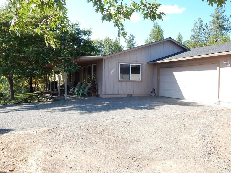 Quiet serenity. This could make a great 4H or horse property. Lots of wildlife abounds here! Nothing better than relaxing in your rocker on the front porch taking in the views of the Table Rocks and valley below. This lovely three bedroom, two bath home of 1,700 sq. ft., built in 2000 offers easy care living. The garage is finished and insulated with two walls of cabinets and counters and remote door opener. Showing pride of ownership, I think you will love it like they have.
