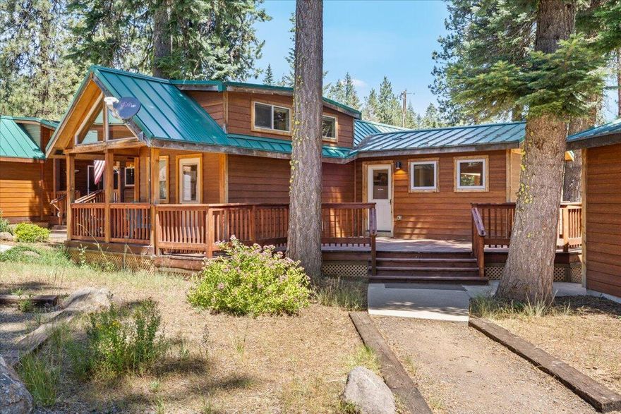 Not all cabins are created equal. With its huge living room, two-car garage and spacious deck, Cabin 32 is one of the crown jewels of the Cabins at Hyatt Lake Resort. The peaceful resort feels far from city life, though it's just a short drive to town. The cabin's large, sunny living room, kitchen and primary bedroom are all downstairs. French doors from the dining area lead out to an oversized deck complete with covered seating, barbecue and hot tub. Enjoy forest views while entertaining. Guests will love the upstairs loft with two beds. Cabin 32 has been the owner's personal retreat, and a high-producing vacation rental. Sale includes all furniture, furnishings and appliances, making it an easy turnkey rental. Detached, oversized two-car garage for cars, boat, or personal items. HOA fees of $285/month include water, septic, garbage, TV, high-speed internet, and snow plowing. Owner gets 1/22 ownership in 30.18 acres of land. Short term rentals OK. Cash only - no financing possible.