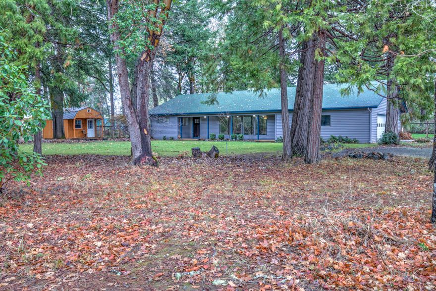 Rural living on 5 usable acres in this spacious and recently renovated 3 Bd 2 bath Home. Featuring a double sided fireplace that has had the spark screen replaced and chimney cleaned last winter. The home is equip with 4 newer ductless heating units and nearly new appliances. The roof was replaced in 2014 and has been treated and cleaned this year. New hot water heater and much more care and maintenance has been completed on the home and on the property. There is an additional detached office or storage shed. Fenced and raised garden beds with plumbing and timers, back yard cross fencing, gazebo with a wood deck and even a chicken coop area. Located approximately 40 minutes to Grants Pass and 60 minutes to the coast. This property is move in ready, all it needs is your personal touch to make it your home.