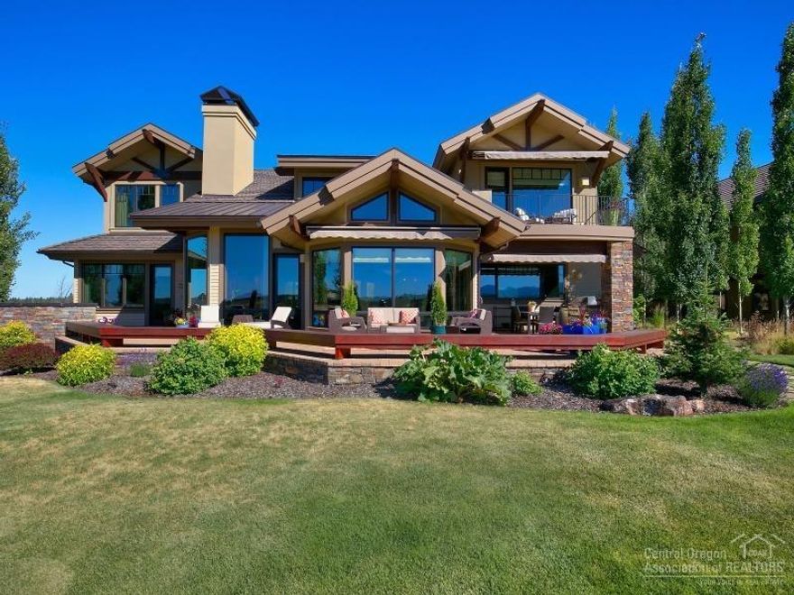 Stunning home built by Pacwest! This one of a kind home is elevated above the golf course with gorgeous Cascade Mtn views. Top of the line finishes include a gourmet kitchen which boast solid slab granite counter tops, island & premier appliances. Luxury upstairs master w/FP, his & her water closets, steam shower, walk-in closet, dressing area, laundry facilities, fitness room & elevator. 2 en suite guest rooms, wine nook w/100-bottle storage, magnificent media room & beautiful office. This home has it all!