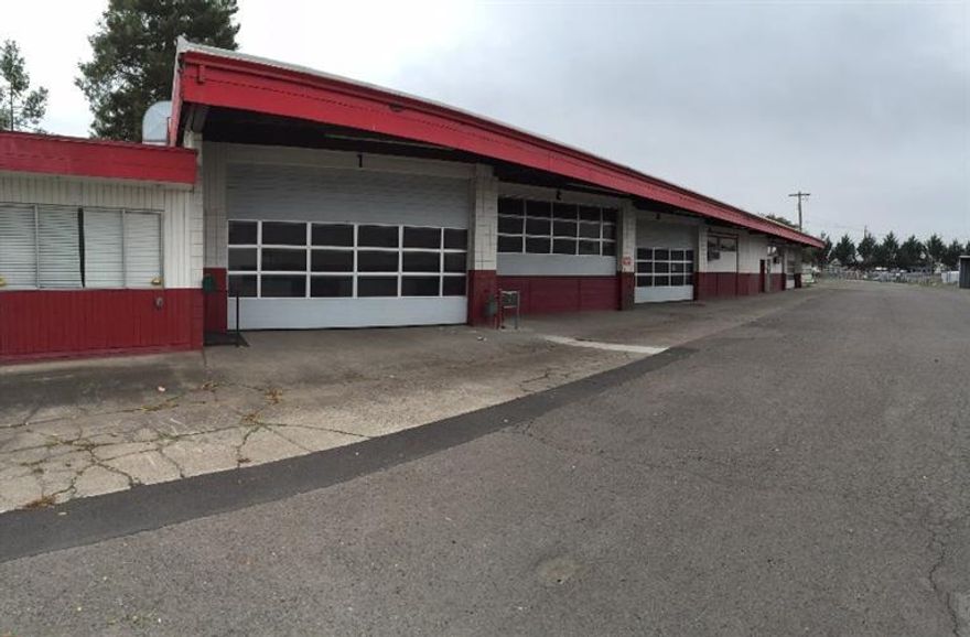 Great utilitarian multi-bay shop building and auxiliary shop/storage building situated on approximately 0.8 acres. Entire property is fenced with a rolling gate in the front, and the majority of the property is paved. The main building is approximately 5,099 sqft with 6 individual bays, office space, a recently installed roof and other upgrades. The secondary building in the rear of the property is approximately 1,920 sqft with a rollup door and lighting. Attached to the secondary building is an additional approx. 1,197 sqft of covered 3-sided storage/work area. Property has a huge monument sign in front. Call listing Broker for showings and additional info. Property is being sold as-is with all faults and defects.