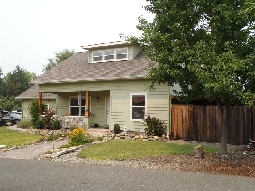 This custom craftsman home built by Dwight Faszer features a covered front porch, open floor plan with large upstairs master and two bedrooms with full bath downstairs. There is plenty of room for your family in this approx. 1536 sq. ft. of functional open living space. Bring your toys, the RV parking is covered and has a concrete slab. This .26 acre lot has a nice sized backyard with views of the hills and is close to recreational trails. This home has a country feel with the convenience of city living. Located on a quiet street in the Fruitdale area, in the Autumn Crest subdivision. Enjoy having your own well and city sewer. Call today to show this beautiful home!