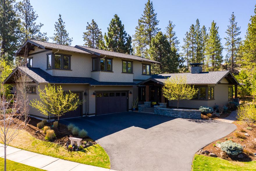 Grace & elegance opens the door in this custom designed home in the Reserves @ Broken Top. Built by COBA Tour of Homes award winning builder, Structure Development quality & craftsmanship are apparent from every angle. This home epitomizes sophisticated class. This beauty is located on large corner  lot w/private back outdoor living space and desirable NW contemporary architecture. Home boasts hardwood floors on main living, quartz slab counters throughout with clean lines, modern & tasteful fixtures. Light & bright with nature surrounding you from the vast large windows and french doors. Open concept living with cook's dream Island kitchen, SS appliances, commercial style range/hood, prep sink area, amazing cabinetry w/glass accents gives this wonderful kitchen a modern farmhouse flair. Fireplace in great room, Master/Spa-like Ensuite on Main, large den just off the 
spacious foyer entry, bonus room. Beautifully landscaped, across from trails, living your best life awaits you here!