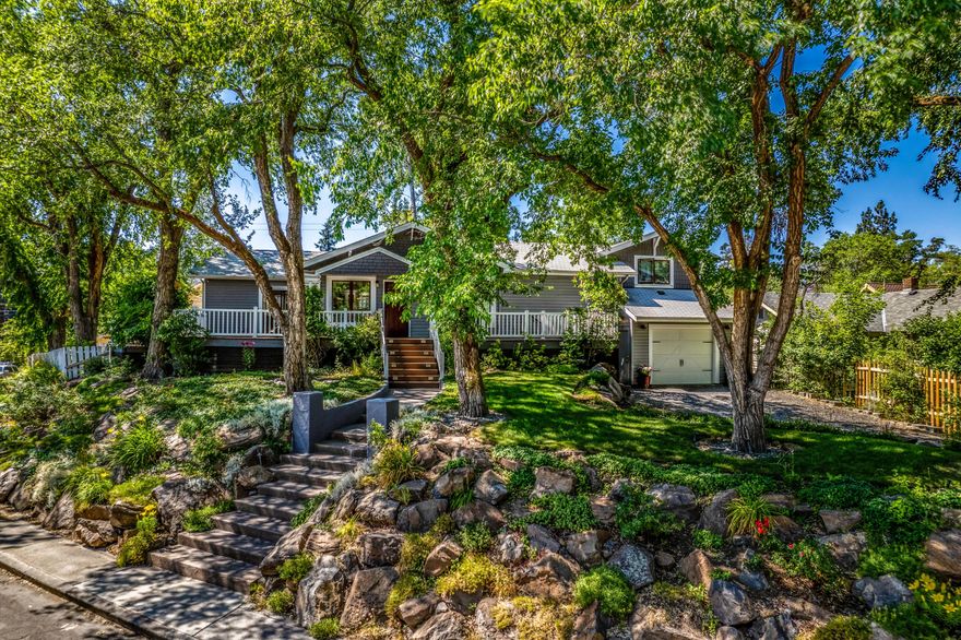 Location, location, location! Great home with ADU and studio. Charming setting near downtown Bend. Quiet location. Main house is 2 bedrooms, 2.5 baths w/tripple car garage. This home has a commanding presense in the neighborhood. The lush landscaping on this charming lot lends to the sweeping view from this stately 1930's home on a tree lined expansive corner lot in the heart of downtown Bend's historic district. Just a couple blocks from Bends Downtown, 6 blocks to beautiful Drake park and the Deschutes river and 8 blocks to the Old Mill. Inside you will find a charming updated kitchen with all appliances and hot-tub included. A wrap around porch to greet you on arrival. Gable roof, a sunfilled bay window that provides a warm welcome into this single level home with living and family rooms. Master suite with access to private backyard patio and hottub overlooking the gardens. I bedroom apt above the 3 car garage and a small studio with bath and kitchen in the back court yard