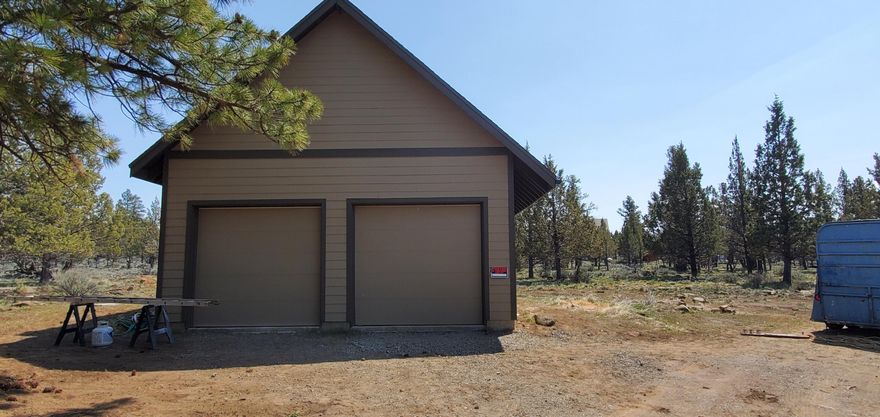 Mountain views!  This 4.81 acre property has a new well, shop/garage with two-bays and huge bonus room above. Interior is unfinished. Private setting and the property has been pruned for fire abatement. Power at property line with temporary power installed at pole. No power to the well or shop. Seller is in the process of finishing power deliver to the improvements. Seller is selling the property in as is condition. Seller will consider short terms. Want to build your dream home, this property is ready for you!