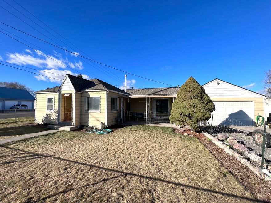 Don't let the square footage scare you! This 2 bedroom, 1 bath stick built home feels much larger than it is. With 2 separate living rooms & a good sized kitchen, there is plenty of space for everyone. The adorable kitchen with walk in pantry is flanked on 2 sides by separate living rooms, giving this home a bight, open feeling with large windows and a sliding glass door leading out to the back yard. Or use one of the living spaces as a formal dining area. Hardwood flooring and chunky baseboards give this home a touch of the home's past while still feeling updated. Parking will not be a problem here! Corner lot with a 2 car attached garage, RV parking, large yard AND alley access, you will have plenty of room for all your toys. Keep your yard looking nice and green all summer with the irrigation well on the property! Located just minutes from downtown Prineville, this could be the home you've been looking for! 1 year home warranty included with purchase as well!