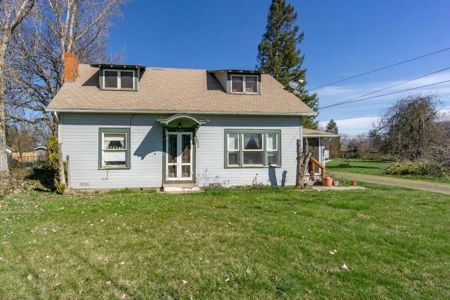$16,000 PRICE REDUCTION! Two-story 1910 charmer with several built-in cabinets and some hardwood floors under the carpet. ACCESS installed new plumbing in bathroom, new exterior siding, additional insulation and some vinyl windows in 2004. The home is situated on 1 full acre of MID-irrigated land and is located just outside of Medford City Limits. County says an ADU could be added with permits. Buyer should perform due diligence concerning development potential.
