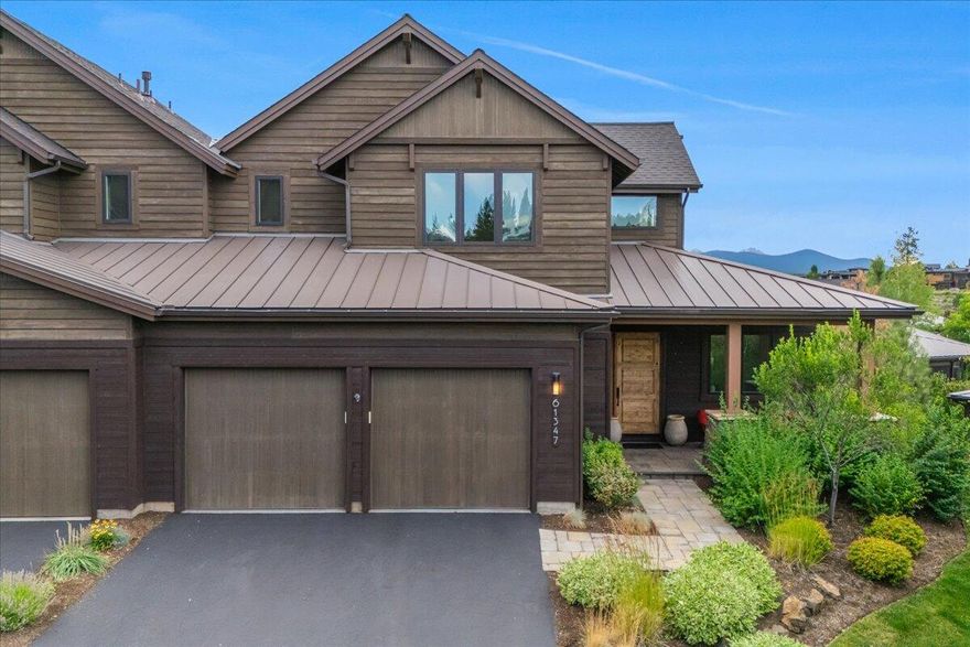 Beautifully appointed townhome at this coveted location in Tetherow! As one of the best situated Triple Knot homes, you will enjoy views of landscaped ponds, green space, and the Cascade Mountains. Inside and out, this home has been meticulously maintained by the original owners and is graced by generous windows, a tiled floor-to-ceiling fireplace, hardwoods and solid surfaces. The main floor living space boasts a beautiful great room with 13 foot ceilings, a chef's dream kitchen, private den/office, Primary Suite/bathroom, and a well-appointed mud/laundry room off of the two-car garage. Upstairs are two additional second-floor suites with the west-facing suite displaying epic mountain views. This home offers luxury living with HOA exterior care. Providing ample space to live out your dreams in Central Oregon whether it's a vacation home or your primary residence.