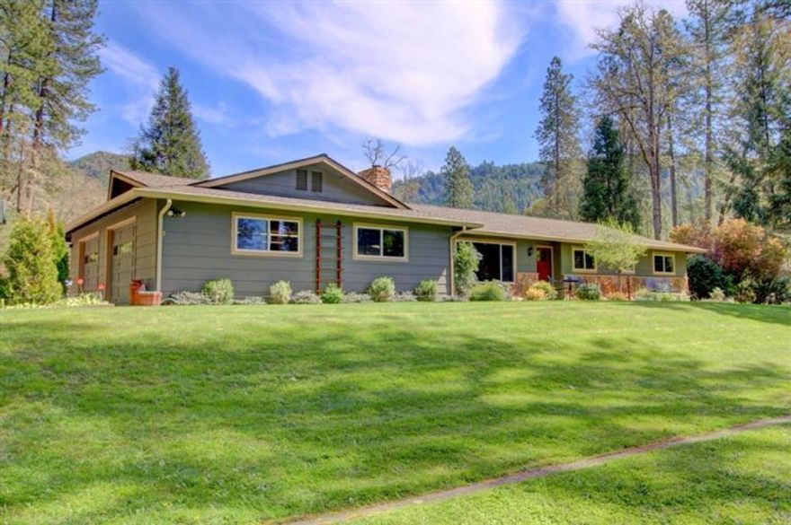 An Amazing & Desirable Location in Rogue River w/Completely Remodeled Home & Spectacular Park-Like Grounds, Minutes to I-5. Very private 2.5 acres, fully fenced, seasonal creek, mature landscaping, large trees, raised garden beds, fenced dog run & even a real zip line. Beautifully updated home w/so many extras & upgrades we couldn't begin to list them all. Newer: Granite countertops, hand-scraped Hickory hardwood flooring, rock surround fireplace w/certified insert, upgraded cabinets, exterior & interior paint, upgraded lighting, tile flooring, custom built-in shelving, upgraded appliances including oven w/warming drawer, upgraded plumbing fixtures, roof, vinyl windows throughout, solid-core interior doors + Much More. Gourmet kitchen w/eating bar, living room w/lots of windows to enjoy the great view, master suite w/2 sinks & custom closet packs, inside laundry, RV parking w/full hookups, storage shed, oversized finished garage + 2-car covered carport. High-producing well (per owner).