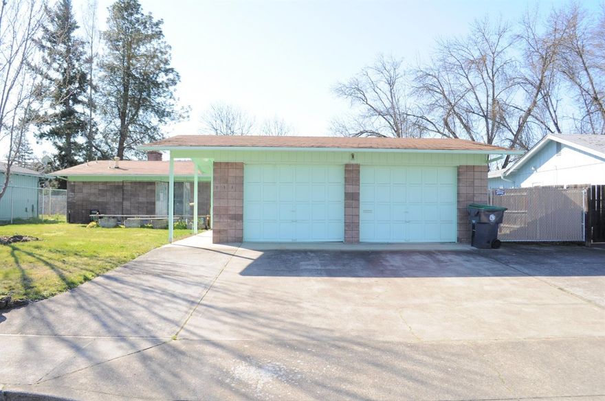 3 bedroom, 2 bath charmer located in a quiet Central Point neighborhood on .22 acre! The floor plan features a living room and family room. Living room has a 2 sided fire place and lots of windows overlooking the beautiful backyard. The kitchen has a window over the sink, bar seating and opens out to the family room. There is also an indoor laundry room off the kitchen. All 3 bedrooms have good sized closets and patio doors. The large master bedroom has a walk in shower in the master bath and opens to the backyard. Out back, there is a deck to sit and enjoy the big backyard and view of the creek - As well as a shed for storage. In the front yard, there is another deck, a detached 2 car garage and small RV parking on the side. Mae Richardson Elementary school district. This home has good bones and is all ready for you to make it your own!