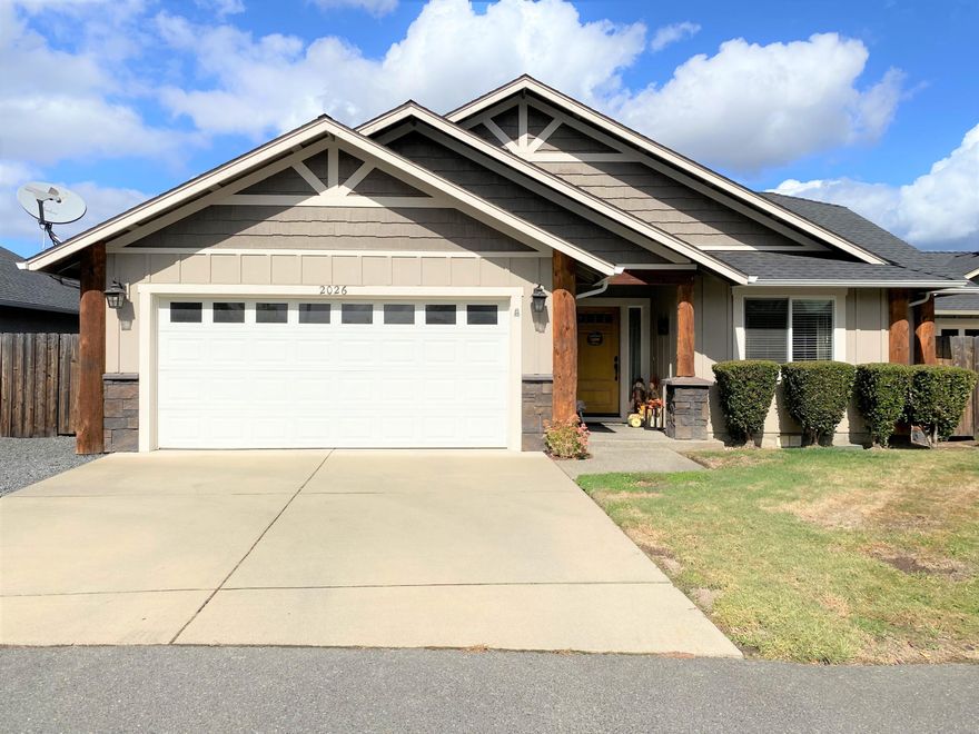 A beautiful turn-key Craftsman home waiting for the perfect family!  Front porch has fabulous log timbers on each side as you enter into this 1412 sq-ft, 3 bdr-2 bath home with decorative built-in shelves in the entry way, vaulted ceilings, custom plant shelves, hardwood floors and an open floor plan.  Kitchen has rich dark walnut cabinets, granite countertops, a great garden window, new stainless-steel appliances in 2018 and a breakfast bar.  Primary ensuite bed and bath have a large walk-in closet and jetted tub.  New carpet in bedrooms in 2018.  Great space in laundry room with lots of cabinets for storage.  Patio outback for BBQs, fully fenced yard as well as sprinklers and drip systems in front and back.  Convenient location with access to shopping and dining.  New HVAC in 2019.  A must see!