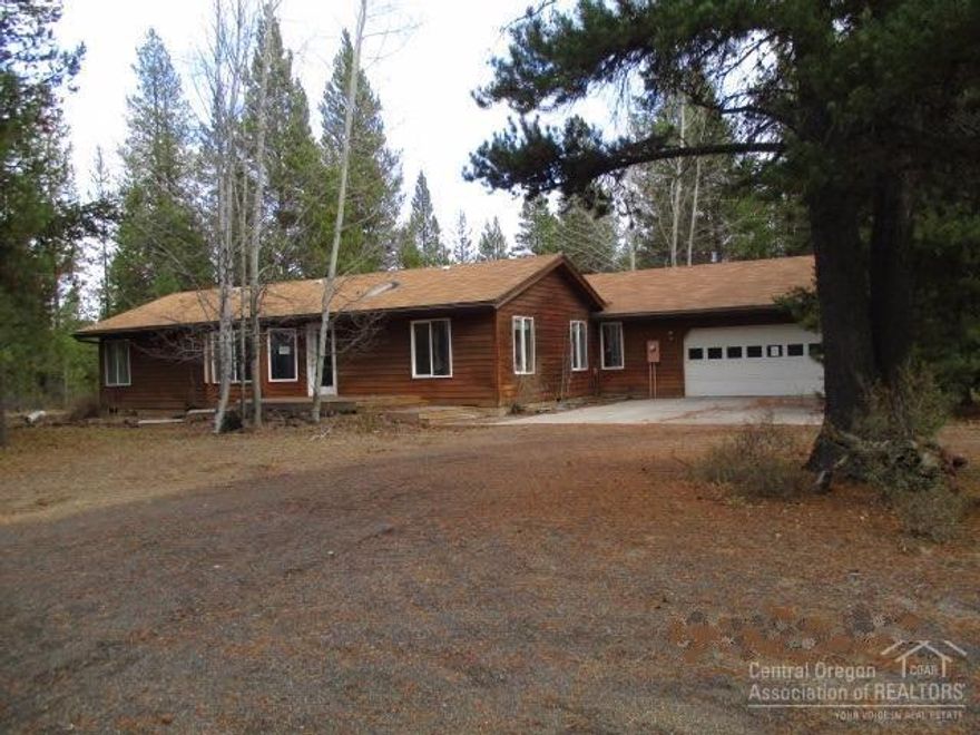 Nice set back from street, this Fuqua home sits on 2.51+/- ac.The home features a formal living room with bay windows, island kitchen, oak cabinets,vaulted ceilings, skylights, Large family room addition w/wood stove for those cold winter nights, 3 Bdrm w/Master separation (French doors to Master suite & bath) 2.5 Bath. Quality throughout. Attached 2 car finished garage & (24x48) 1152 sq ft shop w/cement floor & room for all your toys to play in Central Oregon on the water or the mountains.