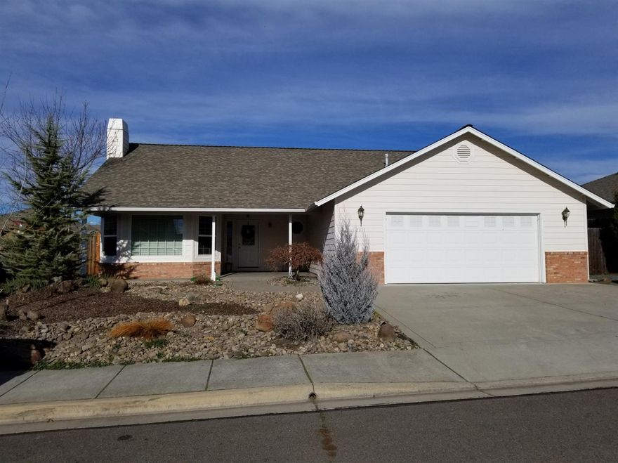 Welcome home to this charming Central Point house in a great, quiet neighborhood. A large covered front porch welcomes you into the well-cared for home where you can sit in front of the gas fire during these cool nights. Landscaping is all on drip and in-ground sprinklers, allowing you to sit back and enjoy the yard from the covered back porch that is pre-wired for a hot tub. Many other features make this home a must-see, including an over-sized spacious garage, vaulted ceilings in living room and kitchen, tray ceilings in the master, and spacious bedrooms. Don't wait, homes like this in Central Point don't last long! Seller is related to listing agent.