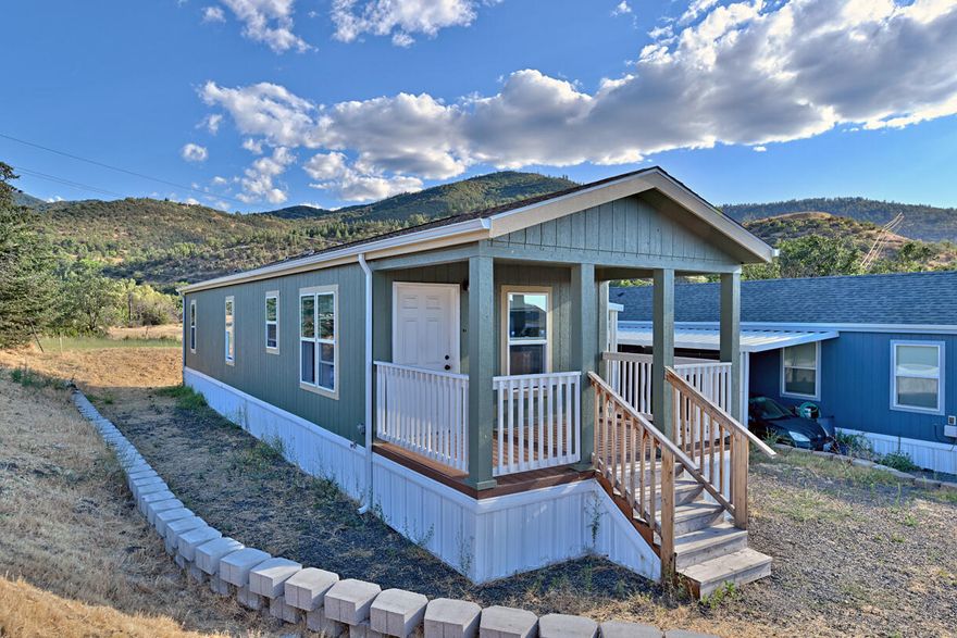 MOTIVATED SELLER! Welcome to 1 Corral Lane #54 — a nearly new 2023-built manufactured home in Bear Creek All Family Park, offering 2 bedrooms, 1 bathroom, and 702 sq ft of bright, efficient living. Enjoy an open floor plan, functional kitchen with modern appliances, and a charming front porch perfect for relaxing. The monthly space rent covers water, sewer, and garbage, making budgeting simple. This well-maintained, all-ages community is ideal for first-time buyers, downsizers, or anyone seeking a low-maintenance lifestyle. Conveniently located with quick freeway access and just minutes from Ashland's shops, parks, and restaurants. Affordable, move-in ready, and packed with value — this home is a must-see!