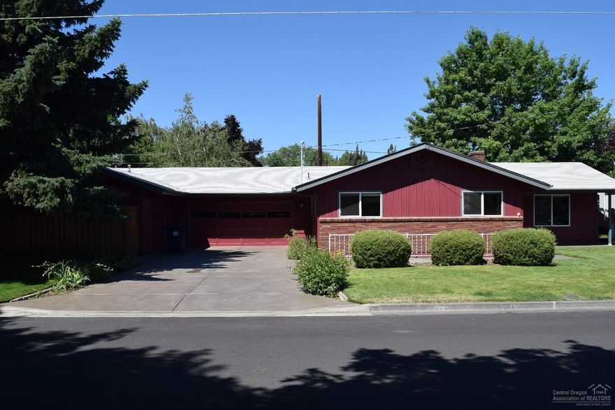 One Of A Kind home with beautiful Landscaping, Established trees, large private corner lot . Double car garage, workshop, Sprinkler System. Well Established desirable NW neighborhood, Gas Heat, huge covered patio. Must see inside this one. Well taken care Of with updated kitchen. 450 square foot additional office & bedroom area. one block to Dry Canyon walking trails,close to park,and schools. Original Red Oak floors, beautiful stone fireplace. Plus wonderful R.V. parking area