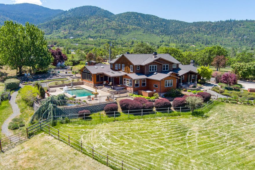 One of a kind estate in beautiful Ashland Oregon. 12.73 EFU acres, Home completely remodeled In 2005 (new roof structure, complete interior, plumblng, electrical, heating and air). Brazilian Cherry hardwood floors throughout, Pella Wood windows, solid core alder doors, custom hardware. Kitchen features views of the mountains, granite countertops propane gas wolf cook top stove 6 burner with custom range hood, double ovens, two dishwashers, sub zero ref and freezer, custom cabinets, copper kltchen sink. Home is wired for sound and data throughout. Sun room with sauna, hot tub, tile floors, wet bar, bbq and high ceilings. Master bedroom and bath have so many upgrades Including fireplace in the bedroom, heated floors In bathroom, large shower, soaking tub. Wine cellar, 3 car garage w/4 car detached, dog kennel. 3,600 sqft barn with six horse stalls and private corrals. In ground salt water pool, Koi pond, 20 kw emergency generator. RV dump station & electrical hook up. Two ponds.
