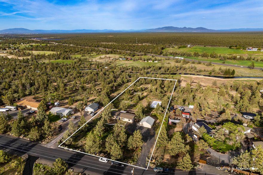 Nestled on a picturesque 2.61-acre lot, this property offers the perfect blend of comfort, convenience, and an exceptional outdoor lifestyle. You will feel right at home in this inviting space, which includes laminate flooring, new carpet in the primary bedroom, granite tile counter tops and a newer roof for peace of mind for years to come. With ample space to store your outdoor toys and equipment, explore the vast landscape, embark on thrilling excursions, enjoy your thriving garden with the ideal sun exposure and relish peaceful moments in your own backyard sanctuary. For dog owners, a short walk down the property will lead you to a canal that resembles a picturesque river. It's the perfect spot for scenic walks with your furry friends. Beyond the property's allure, you'll find yourself conveniently located between Bend and Redmond that will allow you to enjoy great restaurants, shops, trails, rivers and so much more.  See attached video!