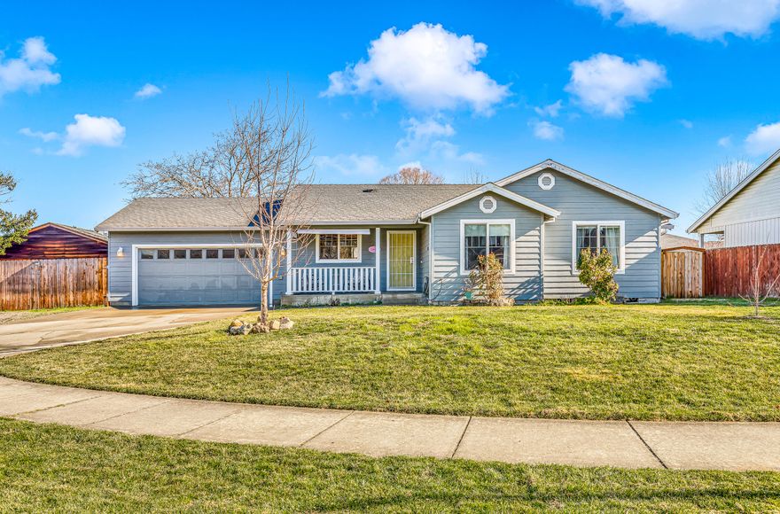 Back on market at no fault of the property! Amazing corner lot home! Sits on .23 acre lot! This is one of the largest lots in the neighborhood! Very quiet neighborhood, no through traffic! Interior features vinyl flooring throughout most of the home, vaulted ceilings in the living room and master bedroom, large walk in closet in master, laundry room with tile flooring, sliding glass door to back yard. Exterior features concrete fenced front porch, plenty of room for RV/boat parking, backyard has fenced off concrete area with two custom made garden box benches that include a drip system already in place, natural gas line for BBQ, large side yard fenced off ideal for garden or area for dogs, completely dog proofed! Large double door gate to side yard adjacent from garage for additional parking/vehicle storage.