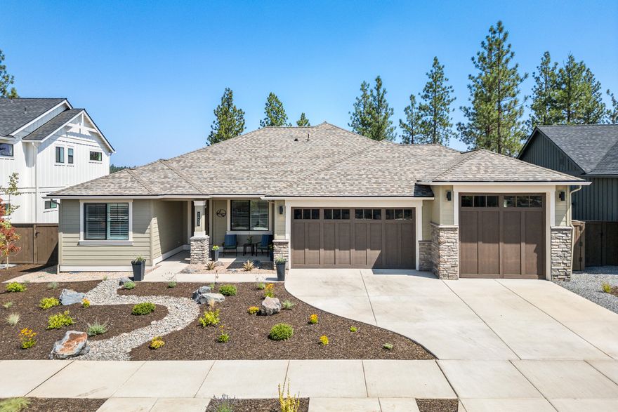 This stunning single-story home sits on over .33 acres among majestic Ponderosa Pines in NW Bend's sought-after Collier neighborhood, offering the perfect blend of comfort and nature. Expansive windows with custom plantation shutters flood the home with natural light, creating a bright, welcoming space. The layout includes two guest rooms, a versatile office that can double as a fourth bedroom, and a spacious primary suite. Premium finishes such as a tile walk-in shower, custom light fixtures & engineered hardwood flooring throughout enhance the home's appeal. The 3-car garage features epoxy flooring and a 10-foot-tall third bay door, ideal for taller vehicles and outdoor gear. Outside, a large partially covered deck overlooks the serene trees and a spacious backyard, offering a peaceful, private retreat. Conveniently located near The Corner & Northwest Crossing for shopping and dining, and close to parks, schools, and trails, this home is ready for its new owner.