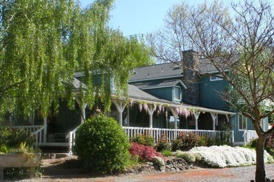 Beautiful ranch nestled in the Jerome Prairie Valley of Grants Pass, OR. This 3 bdrm/3 bath home, has a barn/shop with guest quarters that has a full bath and artist studio. A 2 story family home that boast a large wrap around deck, with decks off each up-stair bedrooms. Gardens, pool, orchard, pond, alpacas, what more could you want at this private resort setting. Kitchen, mud room, and office all remodeled within the last 3 years. 2 tax lots. Gated entry. Every pump on property has been replaced within 3 years. Come sit on the porch awhile and see what the good life is about. Seller is OR R/E Broker. All info deemed accurate but not guaranteed and subject to change at any time. Buyer to perform all their own due diligence.