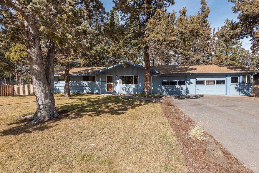 Classic Bend Oregon home one block from Bear Creek Elementary school. Home is set on 1.50 city lots. Extreme care over has been given inside and out. Original Hardwood flooring under carpet. Many updates including Exterior paint, Roof, Vinyl windows. Gas forced air heat & wood stove inserted into fireplace. Addition has rough sawn wood beams, knotty pine hardwood lined walls. Kitchen appliances in home stay with home. Garage extended, great storage. Fenced backyard. Large deck with built in benches, dog run, and storage area for your toys. Great Location and excellent value in this home and property.