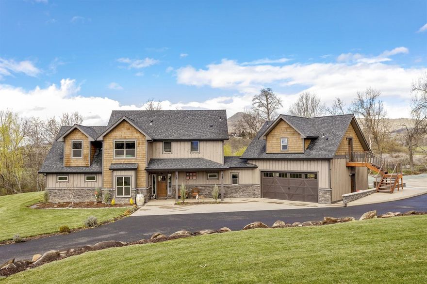 Country setting on 2 acres located within a few minutes to town! A year round creek flows through the property adding to the peaceful setting. This newer home (built in 2015), has a rustic, Montana lodge style feel throughout. A reclaimed, 14 ft beam mantel sets the stage over the fireplace, and the stained pine built-ins and the tongue and groove accents, complete the feel. Concrete countertops throughout. Tile floors that truly look like authentic, rustic hardwoods are stunning. This home has a great floor plan that is open and maximizes the views of the property. Large covered patio, with stamped concrete. Master suite is on the main level, along with a large office. Upstairs has two bedrooms, plus a large bonus room which could easily be a fourth bedroom. There is also a 498 sq ft guest dwelling with it's own entrance. And, a huge 36x42 shop, all finished, heated, with 14 ft doors, and half bath. Covered RV parking and plenty of additional parking.