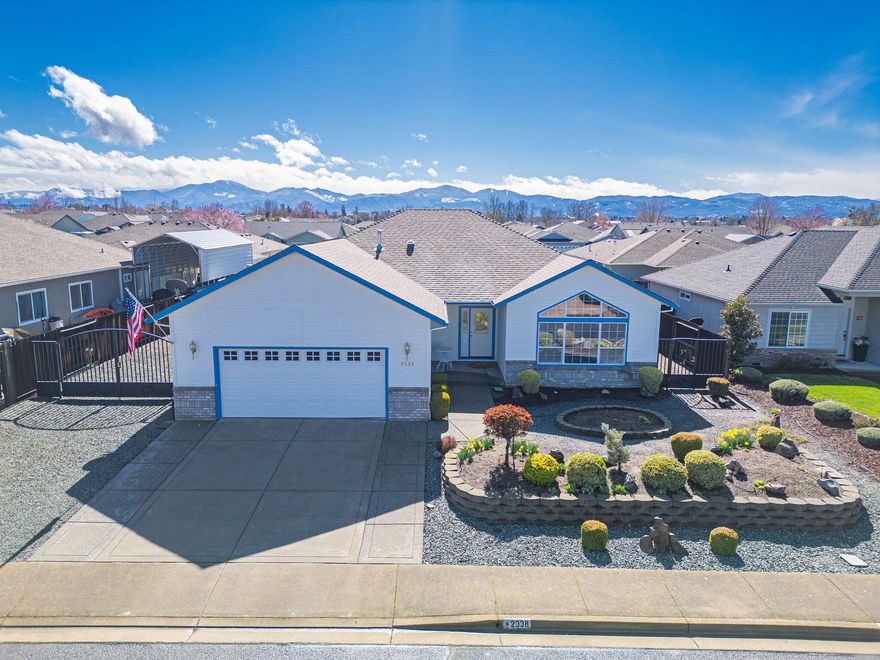 Spacious, Stylish & Ideally Located in Central Point!
This beautifully maintained 3-bedroom, 2-bath home offers 1,969 sq ft of comfortable living in one of Central Point's most desirable neighborhoods. Vaulted ceilings and rich hardwood flooring enhance the open, airy feel throughout the main living areas. The chef's kitchen features granite countertops, a large center island, pantry, and abundant storage—perfect for everyday use and entertaining. Outside, enjoy the low-maintenance yard, RV parking, and a backyard oasis complete with raised garden beds and an adjustable awning, ideal for relaxing or hosting in comfort no matter the weather. Conveniently located near top-rated schools, parks, and shopping. This home blends function and charm in a prime location—don't miss your chance to make it yours!